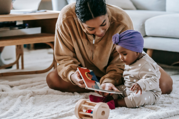 Photo of mother playing with her child.